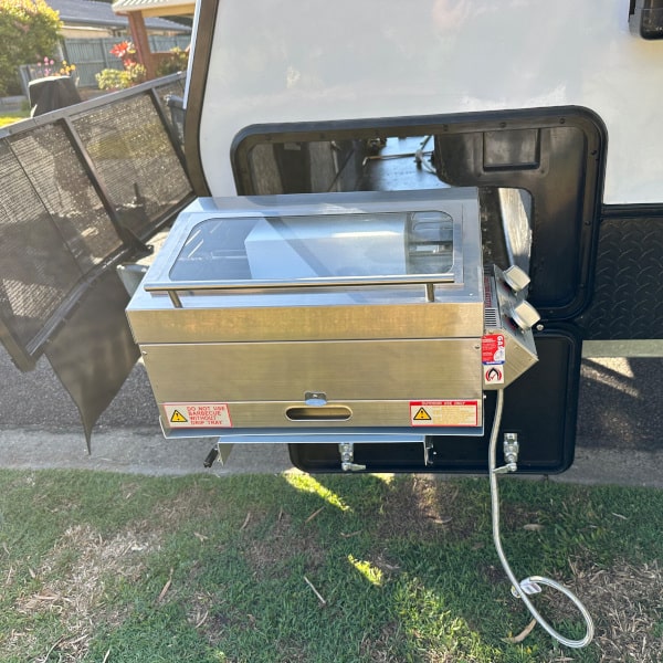 sizzler deluxe caravan bbq sitting on a caravan slide