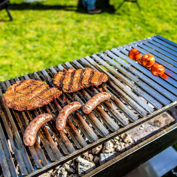 Argetine Parrilla BBQ Grill | Outdoor Central from Outdoor living australia  showing food cooking on it
