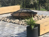 Outdoor Fire Pit Bundle | Cauldron Hearth with Lid and Ember Screen with the ember screen in outdoor setting