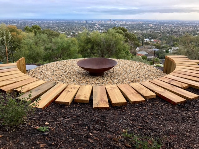 Outdoor Fire Pit: the cauldron hearth with BBQ Grill overlooking a scenice outdoor view