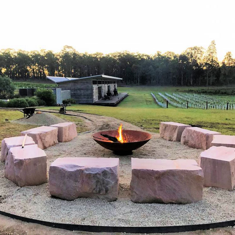 Fire Pit: Mega Cauldron lit with stone seating around it