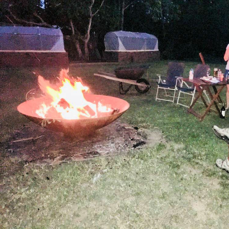Fire Pit: Mega Cauldron lit in back yard