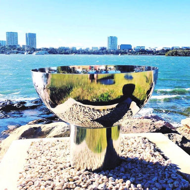 Fire Pit: The Goblet Of Fire in stainless steel overlooking ocean