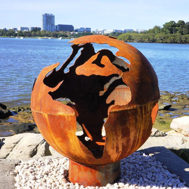 Fire Pit: World Globe different angle near a lake