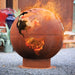 Fire Pit: World Globe lit in backyard side view
