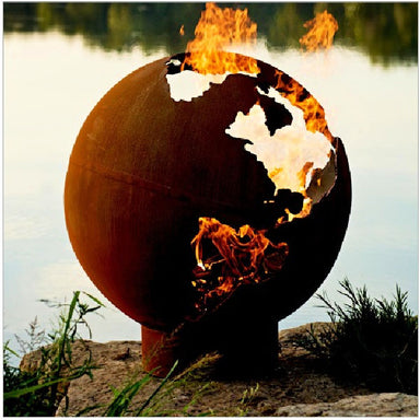 Fire Pit: World Globe lit near lake with a different angle