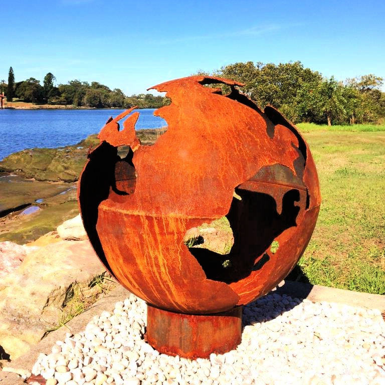 Fire Pit: World Globe side view near water