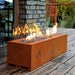 Fireplace | Galio Automatic close up side view of corten fireplace with glass fenders and flames