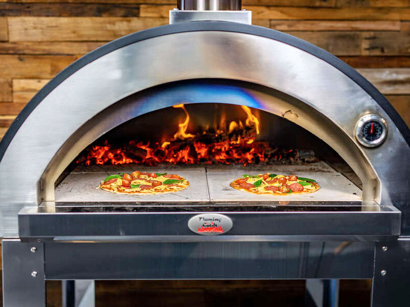 Products Premium Black Woodfire Pizza Oven: Flaming Coals showing pizzas inside